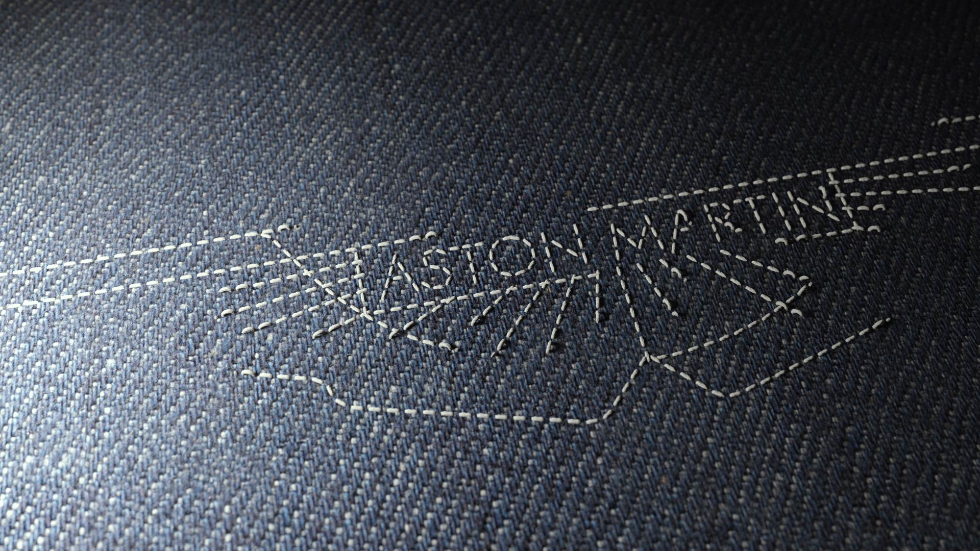 Aston martin logo designed by threads on denim